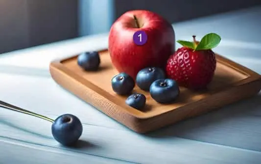 A strawberry and a strawberry on a wooden tray